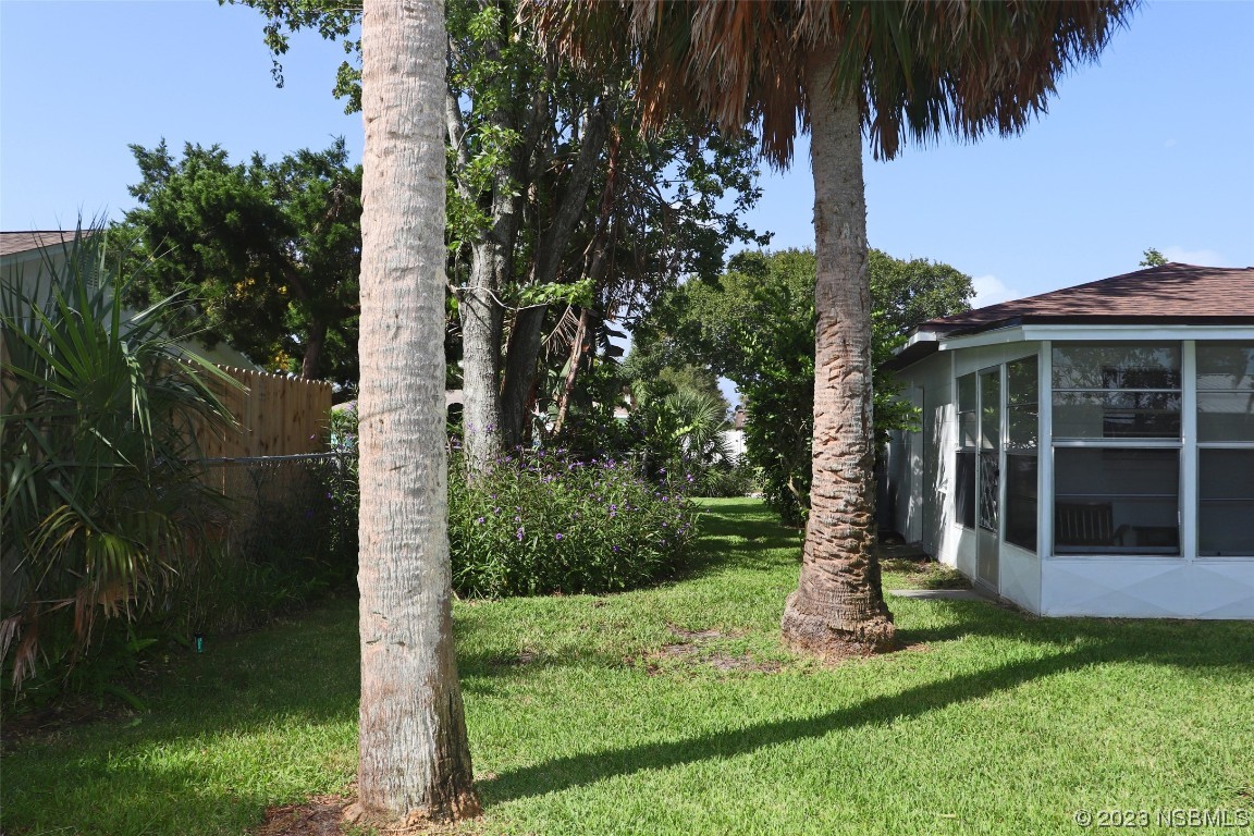 10 Raintree Drive Port Orange, FL 32127 - Photo 30 of 31 a view of a house with a yard