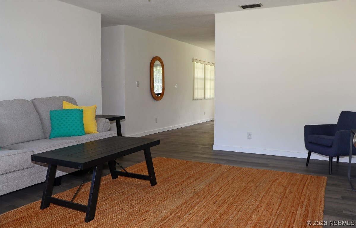 10 Raintree Drive Port Orange, FL 32127 - Photo 4 of 31 a workspace with furniture window and wooden floor
