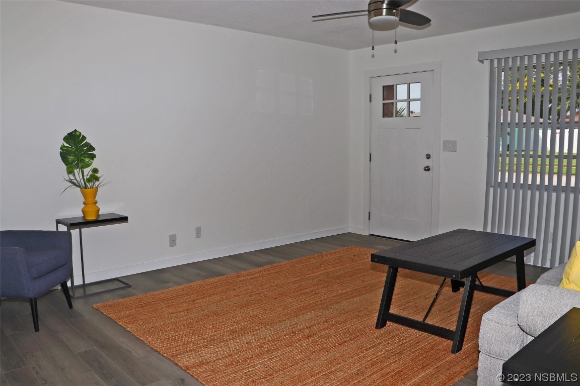 10 Raintree Drive Port Orange, FL 32127 - Photo 5 of 31 a view of a workspace with furniture and wooden floor