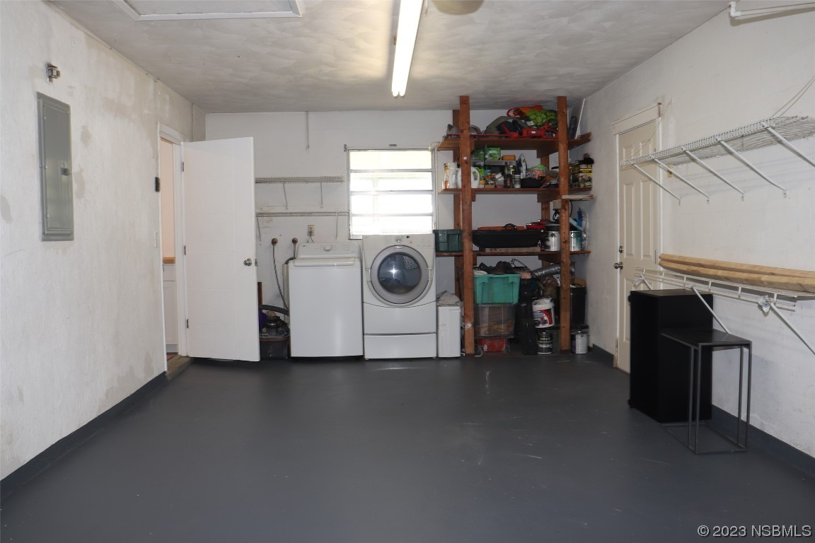 10 Raintree Drive Port Orange, FL 32127 - Photo 8 of 31 a view of a storage & utility room with washer and dryer