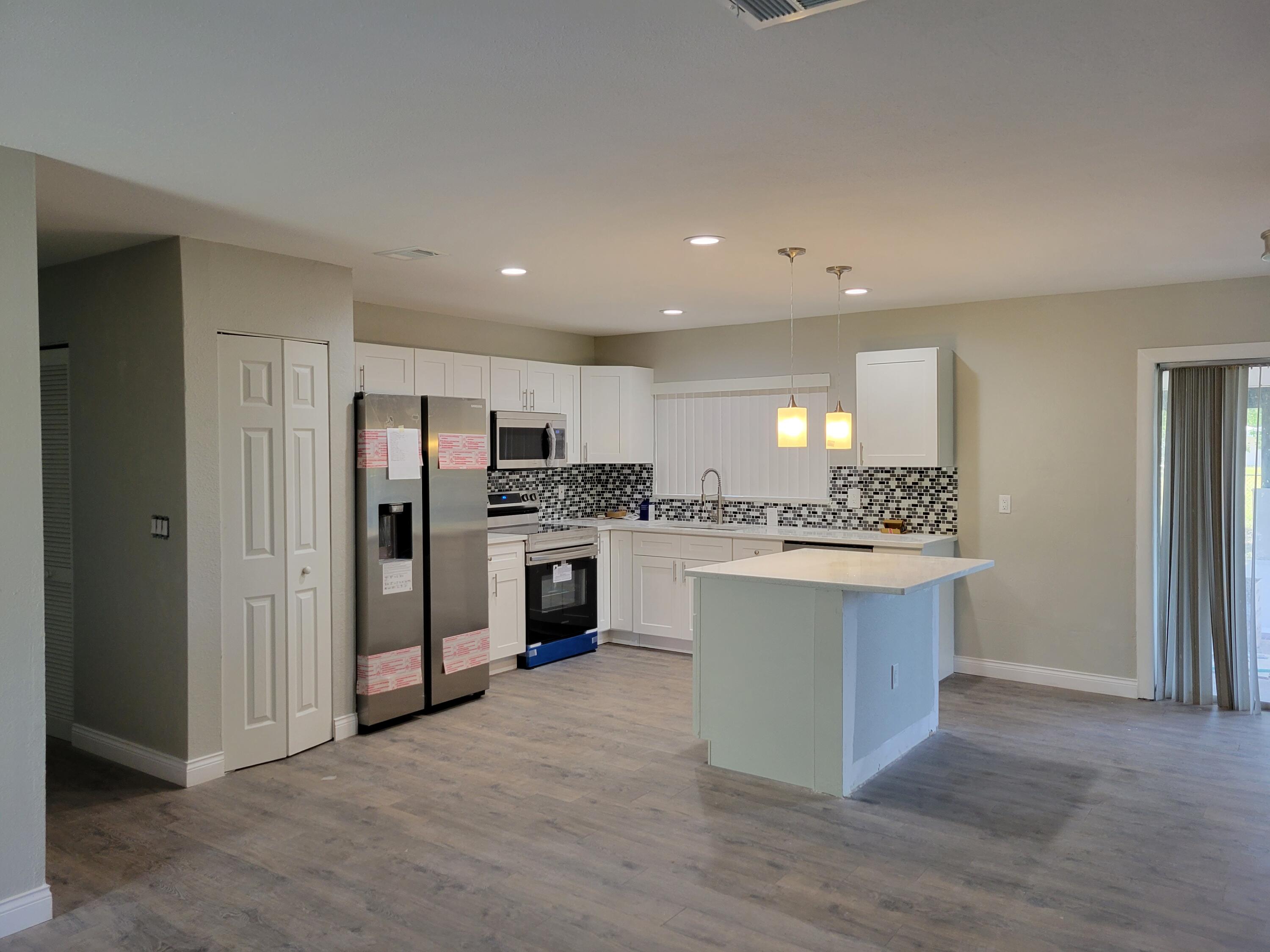 342 Southwest Kentwood Road Port St. Lucie, FL 34953 - Photo 2 of 8 20220417_112326