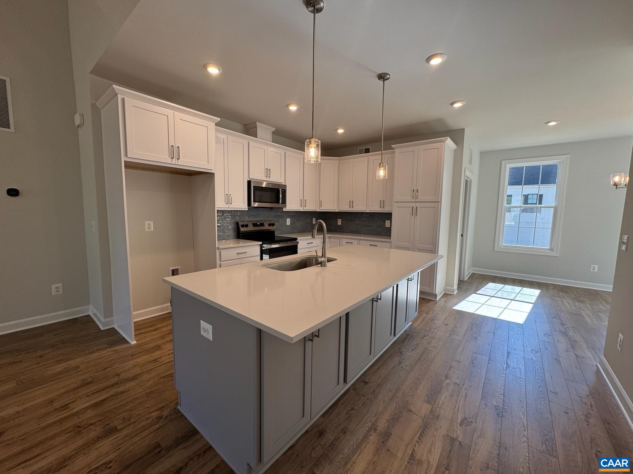 3441 Odom Court Charlottesville, VA 22901 - Photo 11 of 29 a kitchen that has a lot of cabinets and wooden floor