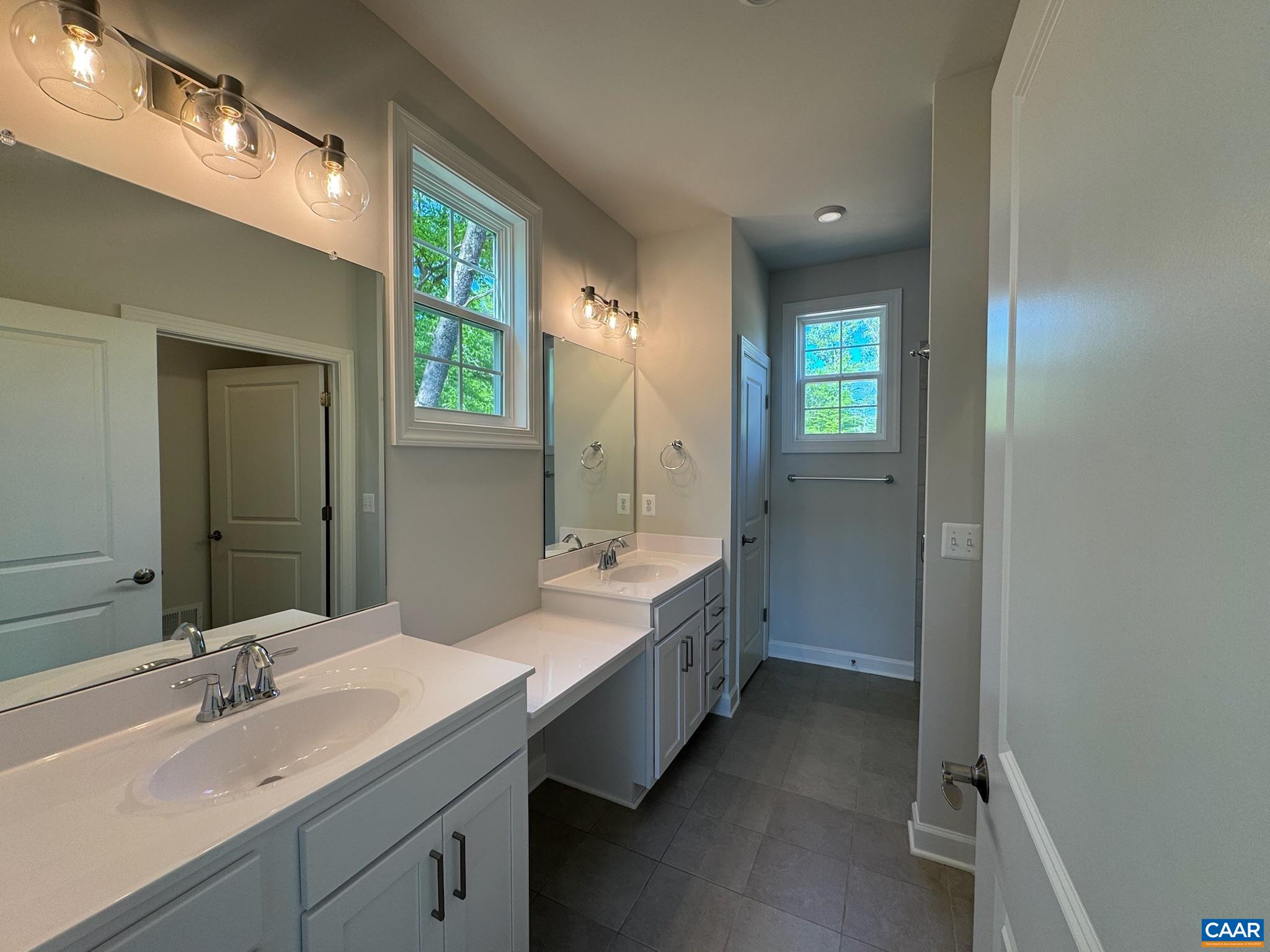 3441 Odom Court Charlottesville, VA 22901 - Photo 20 of 29 a bathroom with a double vanity sink mirror and bathtub