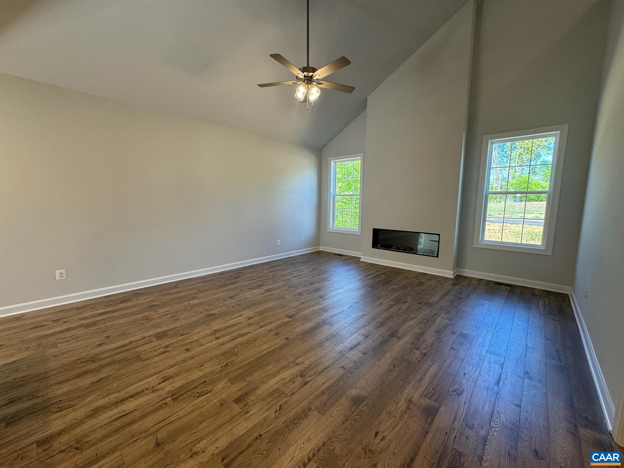 3441 Odom Court Charlottesville, VA 22901 - Photo 8 of 29 an empty room with wooden floor chandelier fan and windows