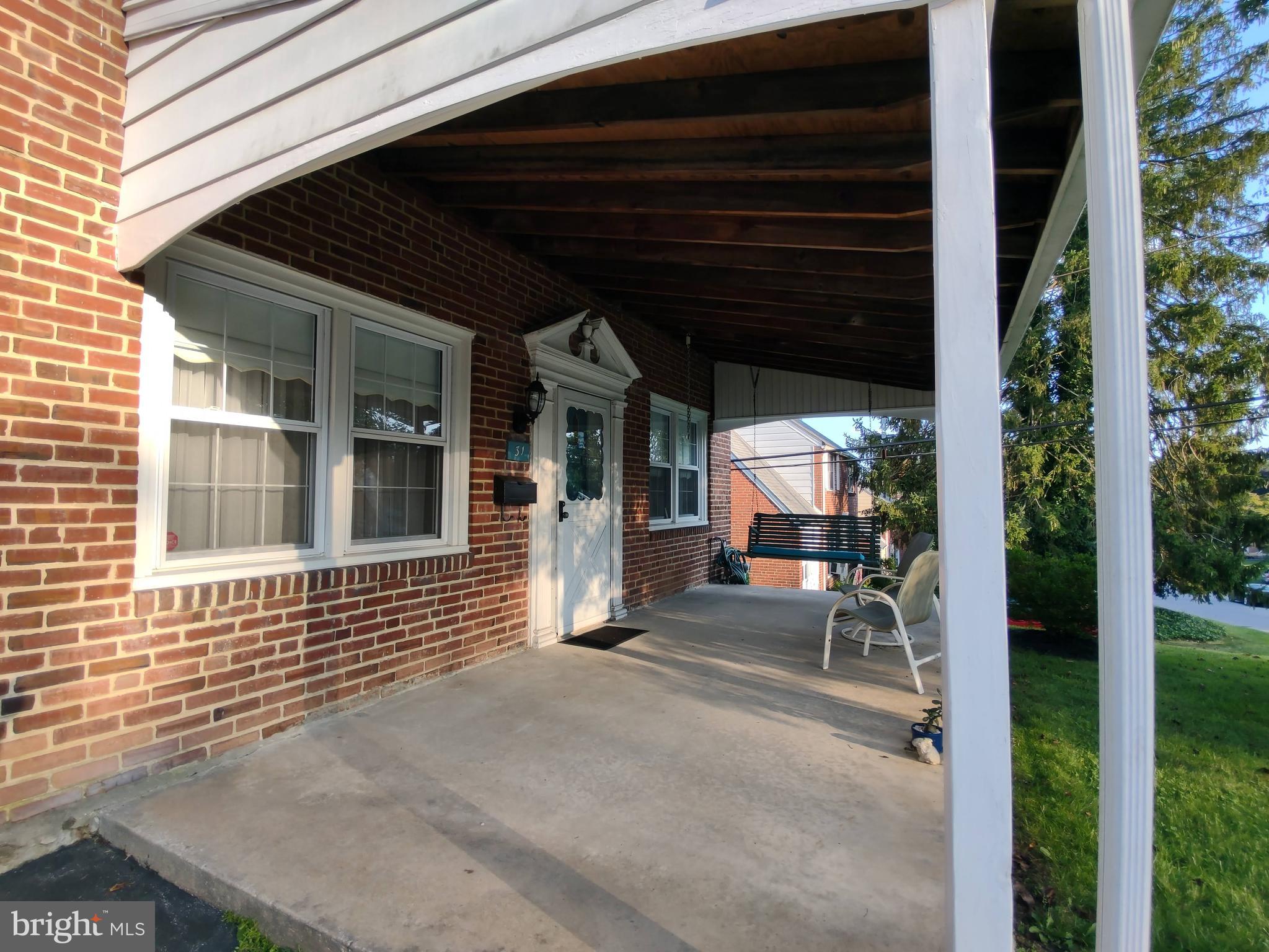 31 West Greenhill Road Broomall, PA 19008 - Photo 8 of 14 Relaxing Front Porch