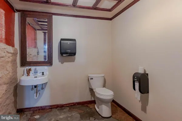 a living room with lots of furniture and kitchen view