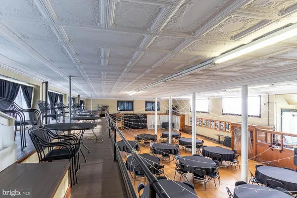 a view of a livingroom with furniture and wooden floor