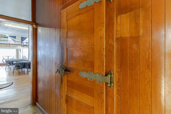a room with pool table and window