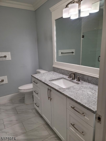 10 Lower Notch Road, Unit 11 Woodland Park, NJ 07424 - Photo 6 of 37 a bathroom with a granite countertop sink a toilet and a mirror