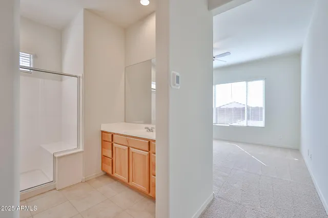 a view of a bathroom with sink toilet and a window