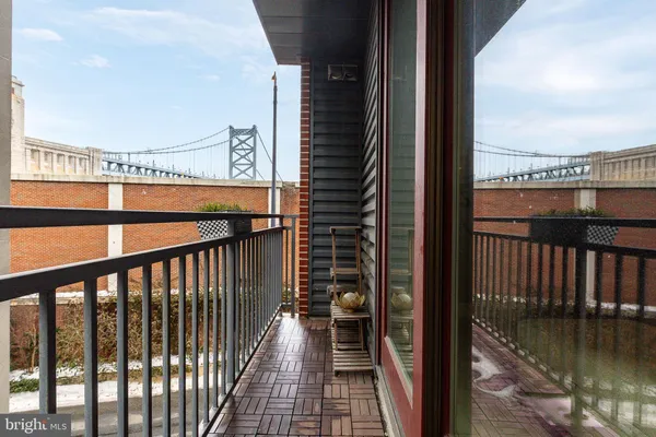 a view of a balcony with a potted plant