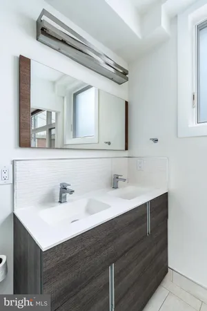 a bathroom with a glass shower door