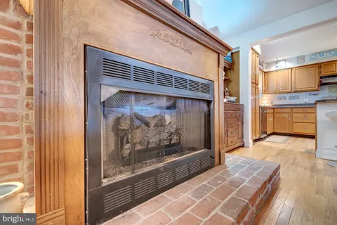 a kitchen with cabinets and chairs