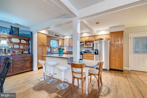 a kitchen with stainless steel appliances granite countertop a stove and cabinets