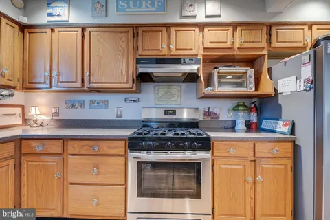 a bathroom with a sink toilet and mirror