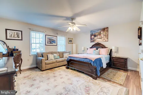 a bathroom with a sink toilet and a mirror