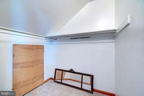 a view of house with backyard