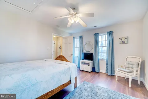 a view of a house with wooden fence