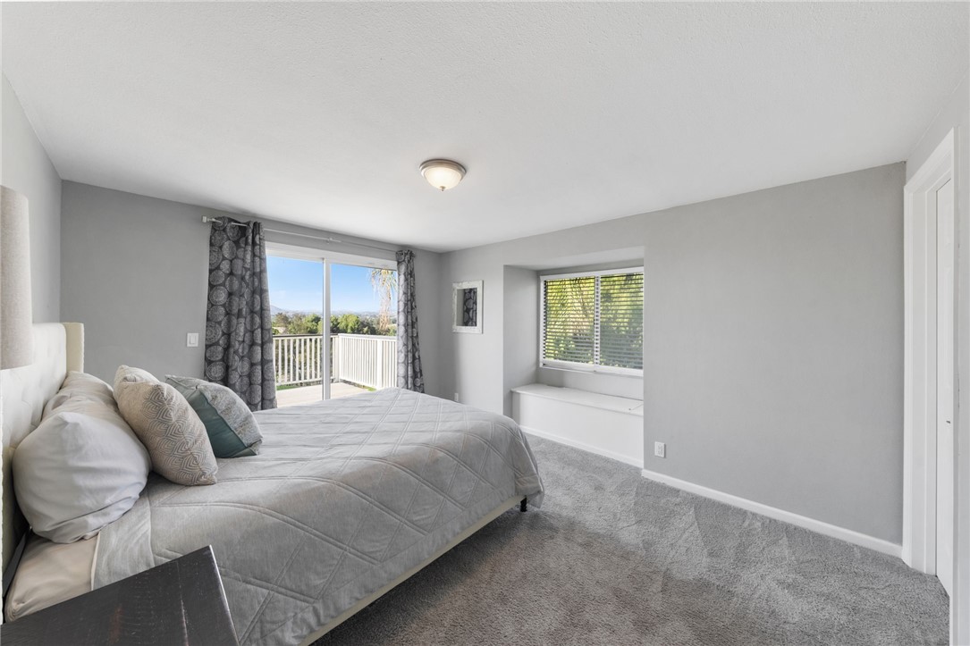 35825 Meadow Ridge Road Temecula, CA 92592 - Photo 50 of 75 a bedroom with a large bed and a window