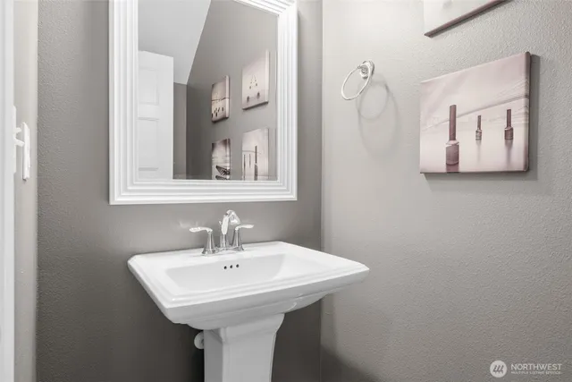 a bathroom with a sink and mirror