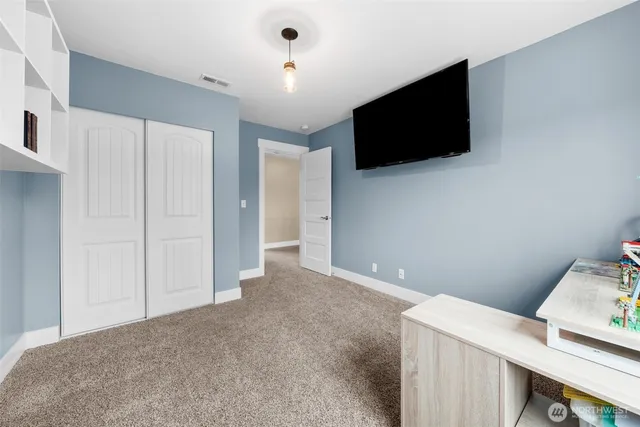 a view of a livingroom with a flat screen tv