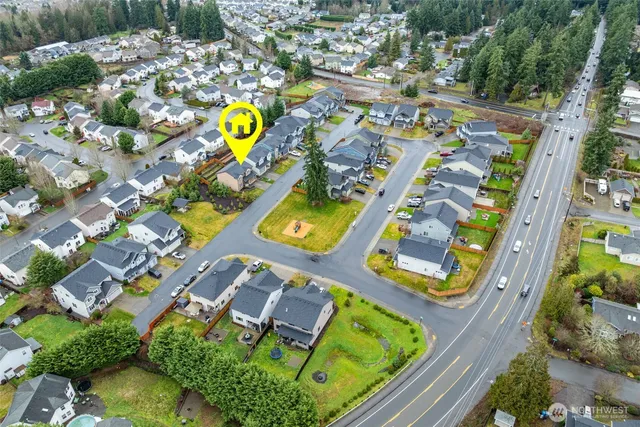 an aerial view of residential house with outdoor space and swimming pool