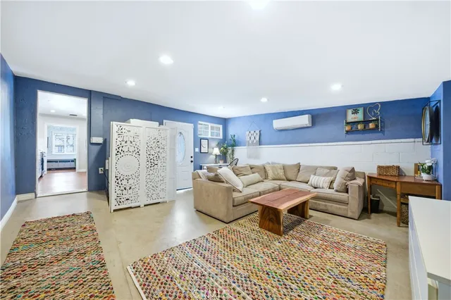 a living room with furniture and a rug