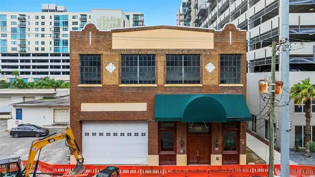 a living room with furniture a rug and a book shelf