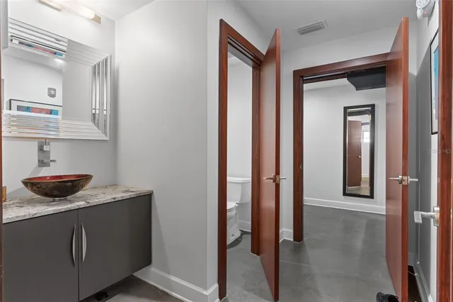 a kitchen with stainless steel appliances granite countertop a stove and cabinets