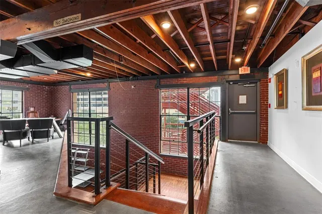 an empty room with an entryway and closet