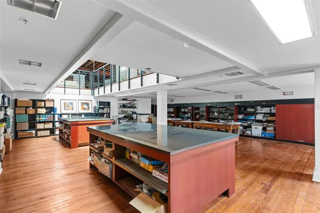 an empty room with a empty space and windows