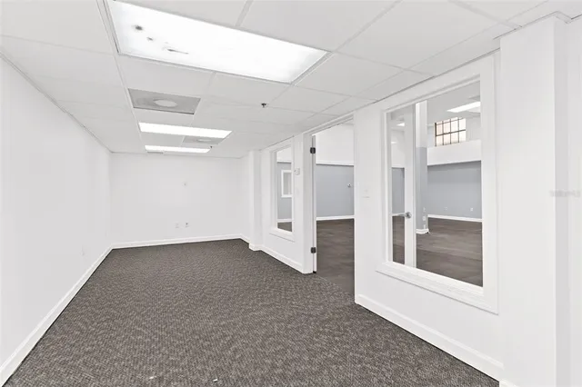a view of swimming pool with outdoor seating and plants