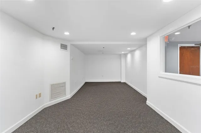 a front view of a building with glass windows and door