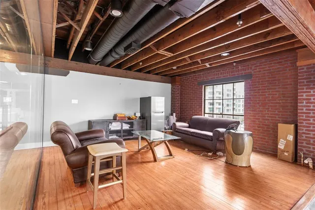 a bathroom with a tub shower sink and mirror