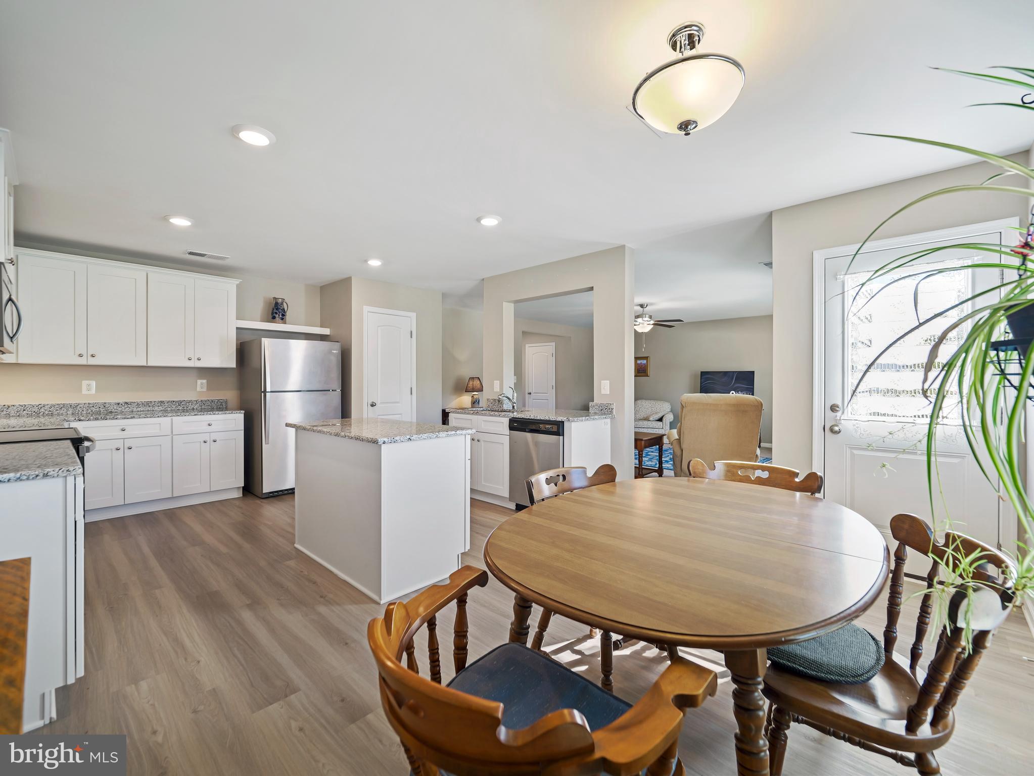 104 Rappahannock Run Falling Waters, WV 25419 - Photo 15 of 41 a view of a dining room with furniture and wooden floor