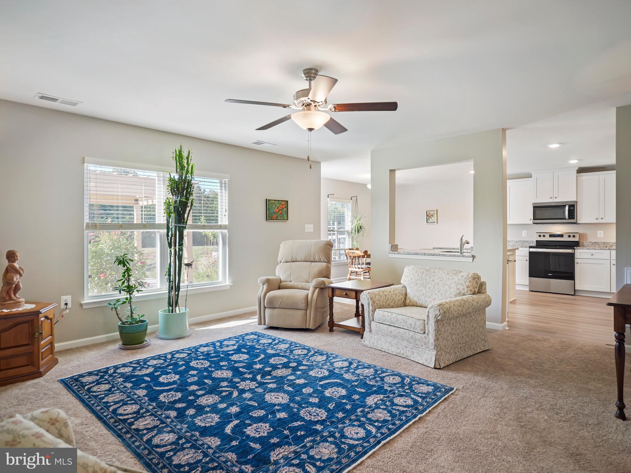 104 Rappahannock Run Falling Waters, WV 25419 - Photo 18 of 41 a large living room with a couch and a window