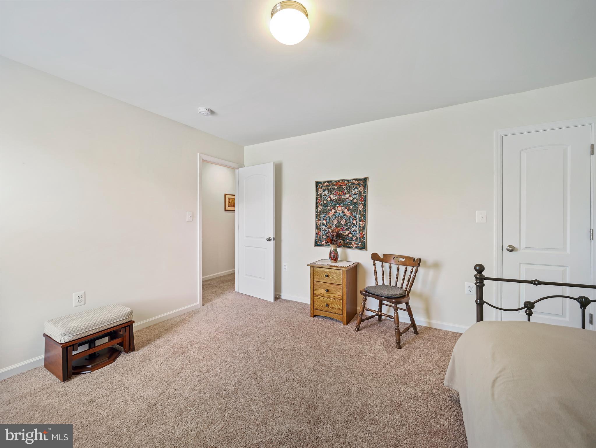 104 Rappahannock Run Falling Waters, WV 25419 - Photo 24 of 41 a bedroom with furniture and a window