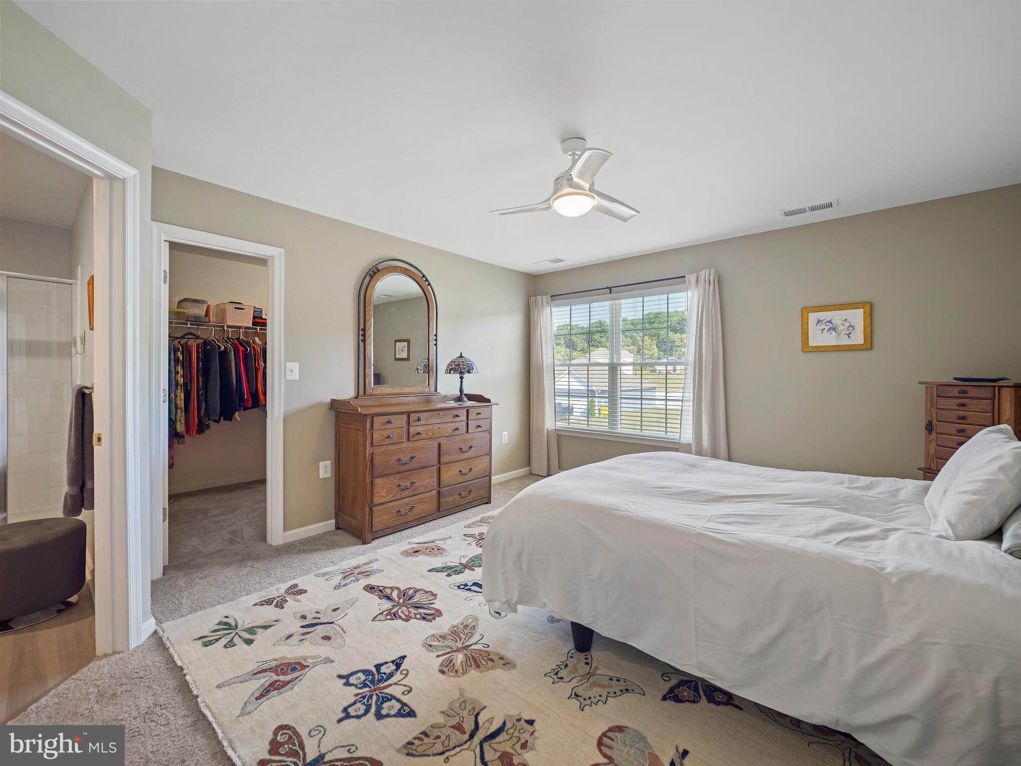 104 Rappahannock Run Falling Waters, WV 25419 - Photo 28 of 41 a bedroom with a bed and a dresser with mirror