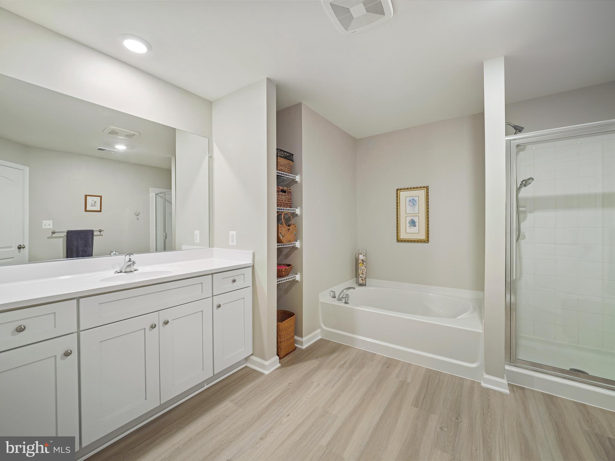 104 Rappahannock Run Falling Waters, WV 25419 - Photo 31 of 41 a spacious bathroom with a tub sink and a mirror