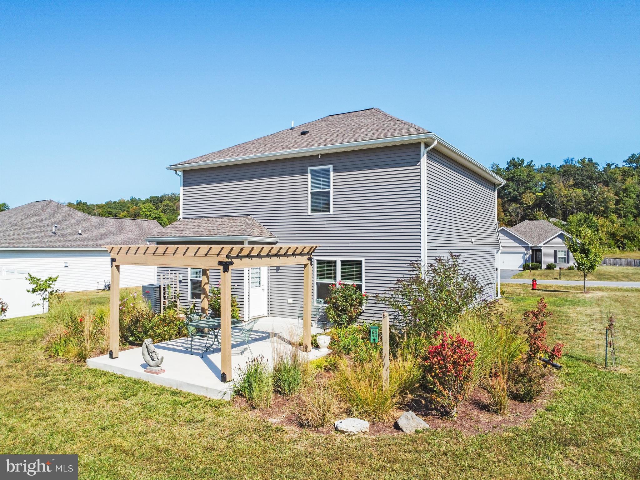 104 Rappahannock Run Falling Waters, WV 25419 - Photo 39 of 41 a view of a house with backyard porch and furniture