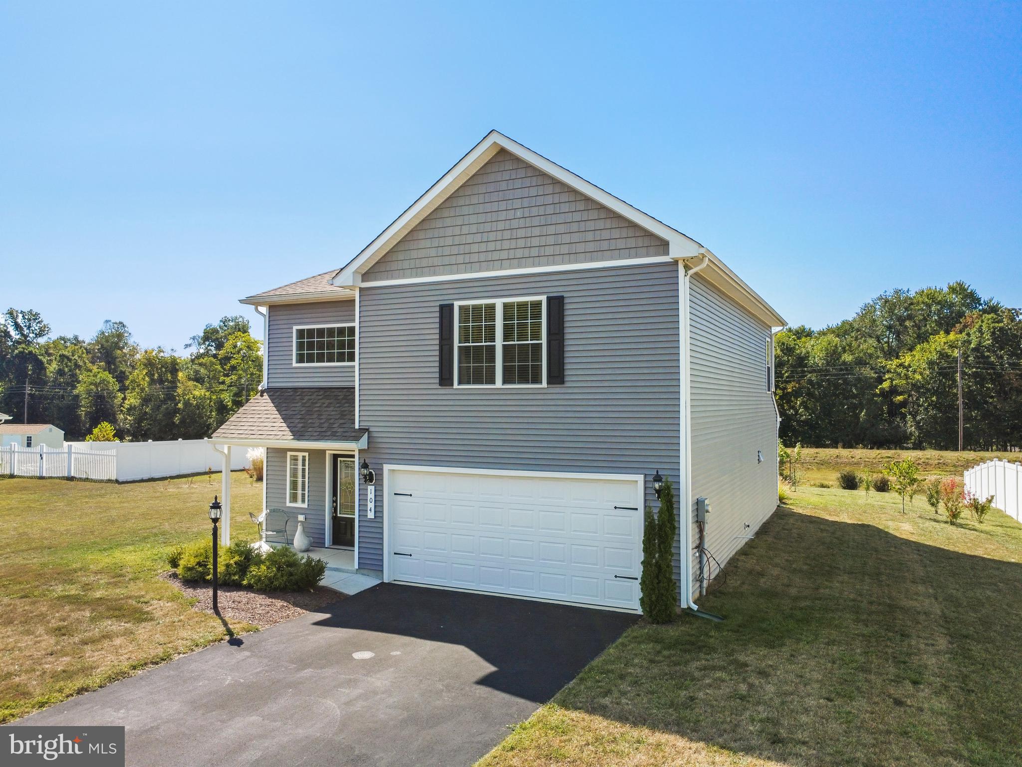 104 Rappahannock Run Falling Waters, WV 25419 - Photo 40 of 41 a view of a house with backyard and trees in the background