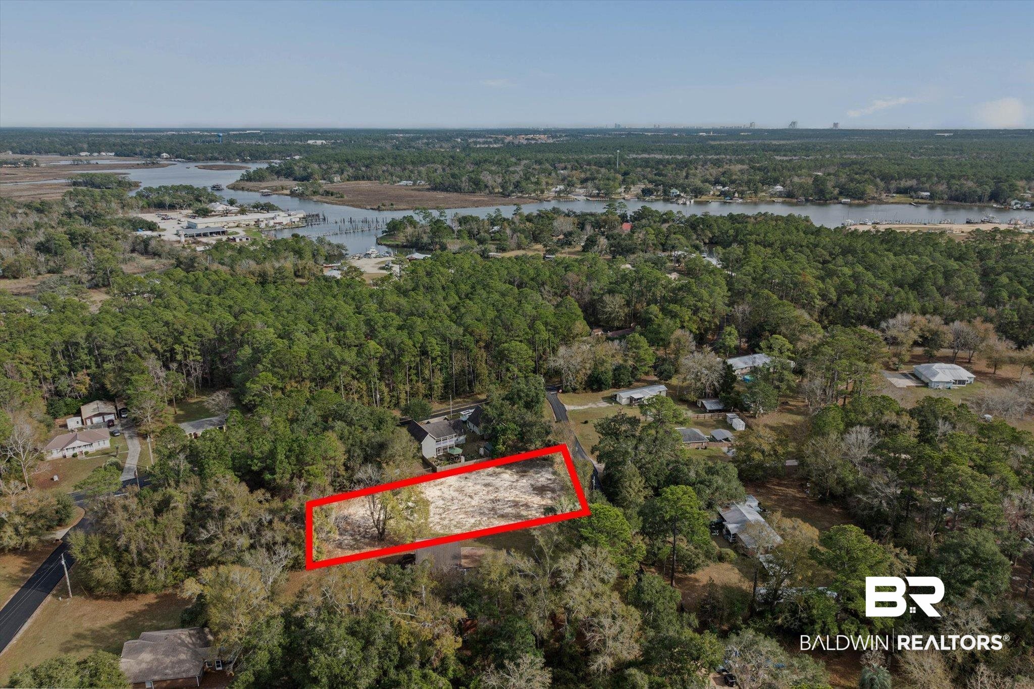 17065 Britt Lane Bon Secour, AL 36511 - Photo 10 of 15 Aerial view of property and surrounding area with property boundaries highlighted and a large body of water