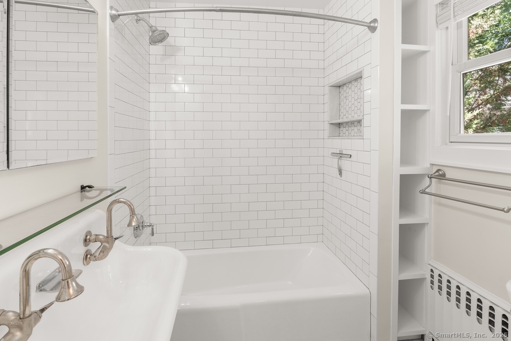 223 Middlesex Road Darien, CT 06820 - Photo 15 of 24 a bathroom with a bathtub and shower