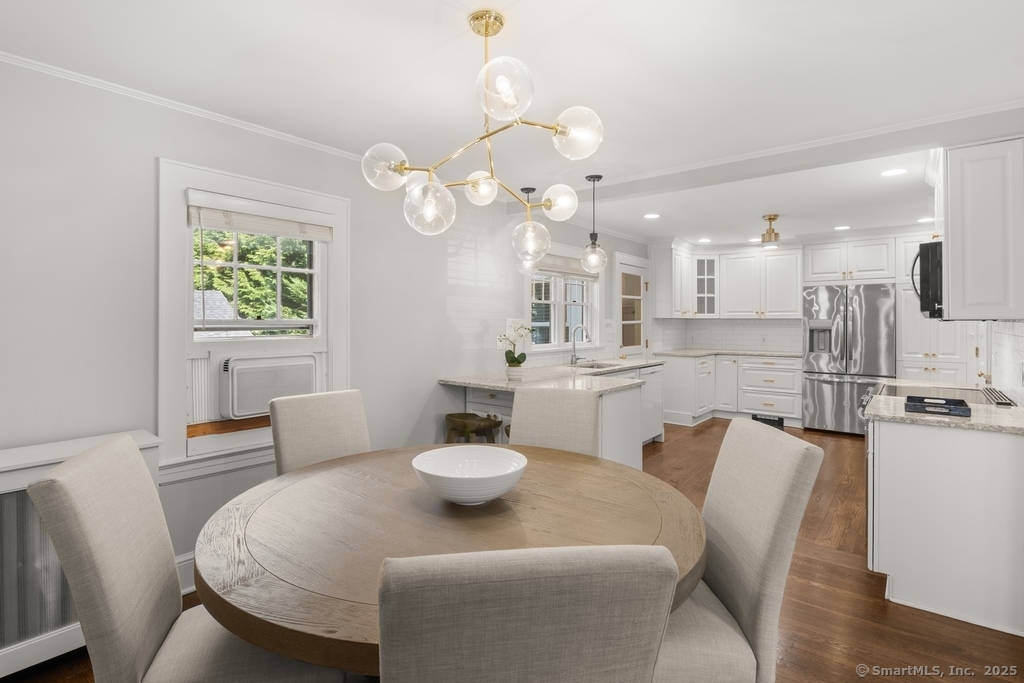 223 Middlesex Road Darien, CT 06820 - Photo 7 of 24 a view of a dining room with furniture and a chandelier