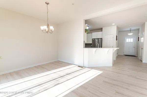 a view of a livingroom with wooden floor
