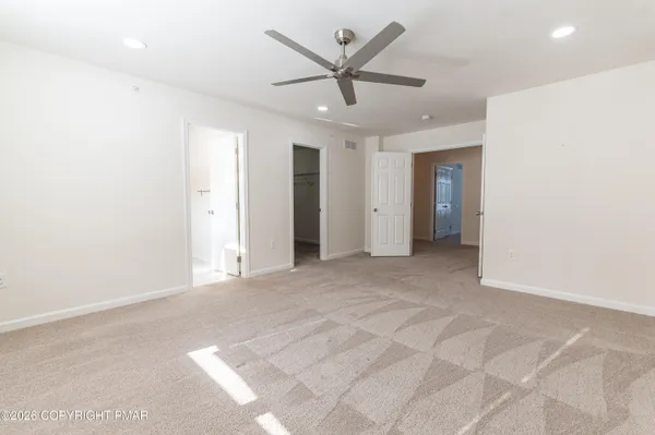 a view of a livingroom with a ceiling fan
