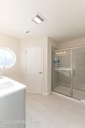 a view of an empty room with a bathroom