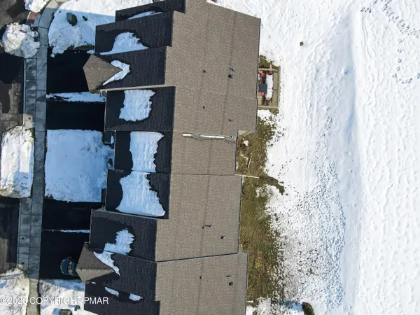 an aerial view of residential house with parking space