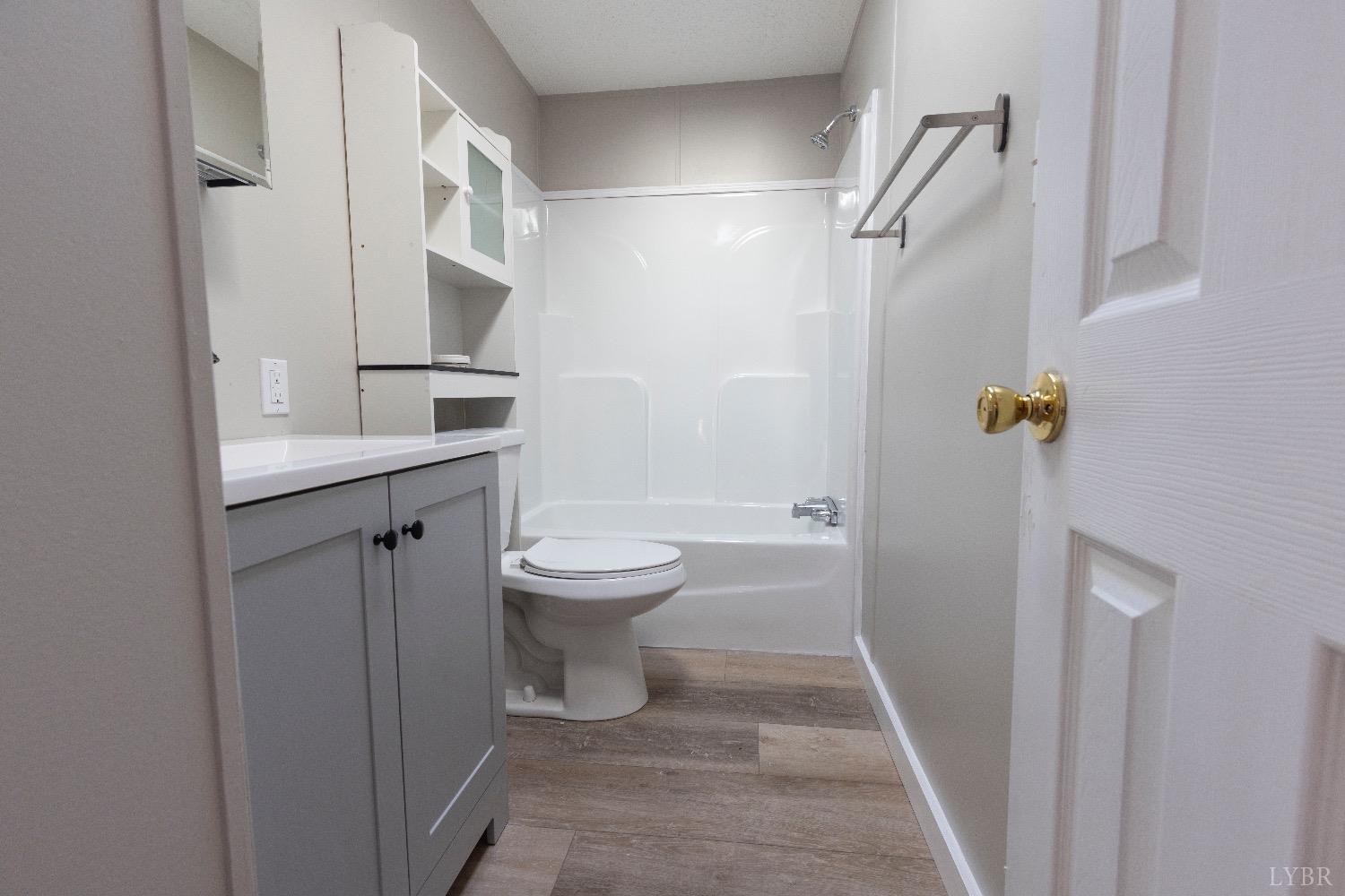 2540 Goode Road Goode, VA 24556 - Photo 23 of 37 a bathroom with a toilet and a sink