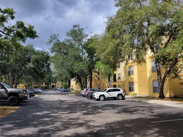 a view of a cars park in front of a house
